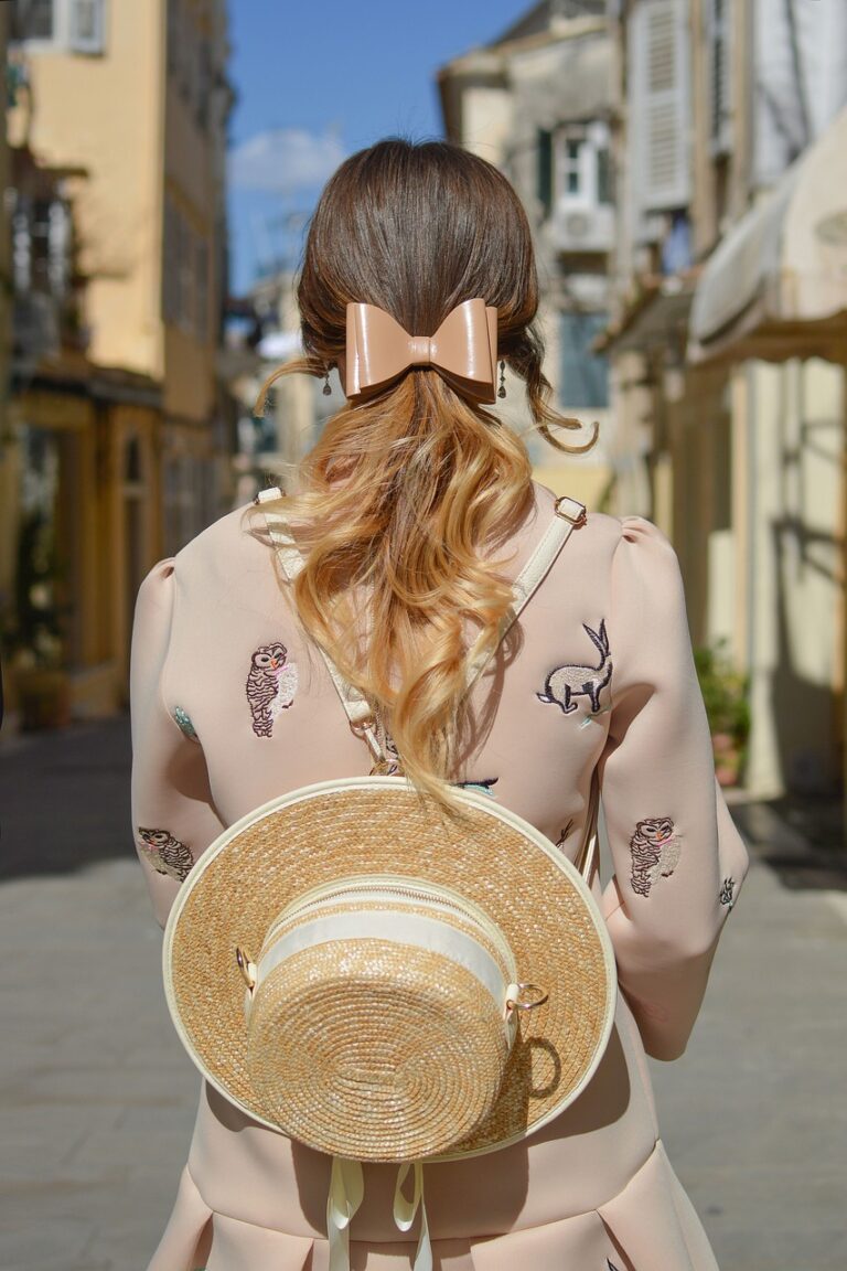 back of lady with hat and bow overseas